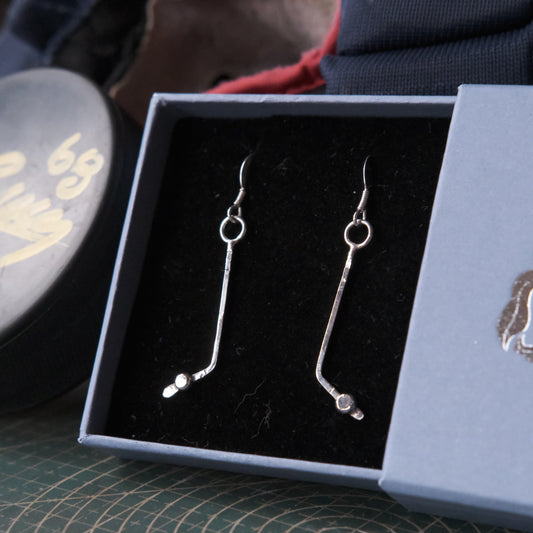 A pair of sterling silver ice hockey earrings