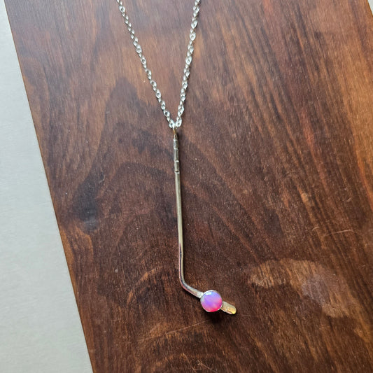 Sterling silver ice hockey necklace set with a synthetic aurora opal puck 