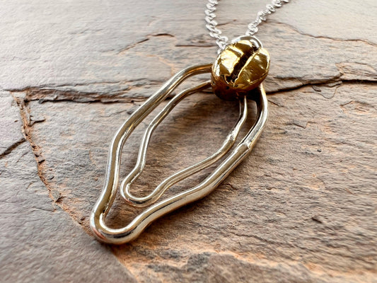 Sterling silver vulva necklace with brass coffee bean - Sølv Lines